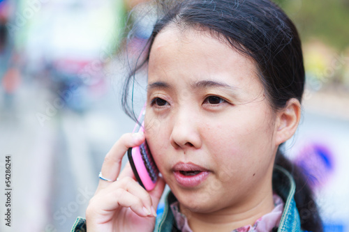 Asian woman talking to phone