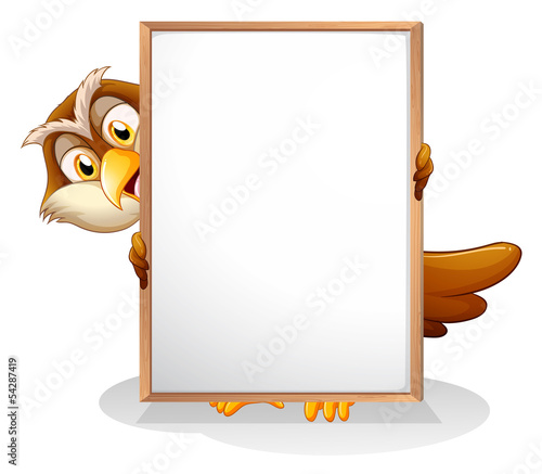 An owl holding an empty board