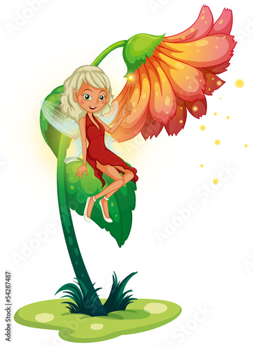 A fairy floating near the giant flower