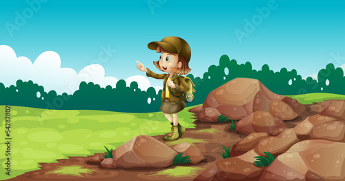 A female explorer near the rocks