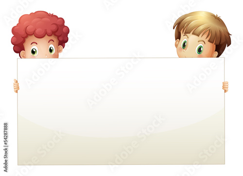 Two boys holding an empty banner