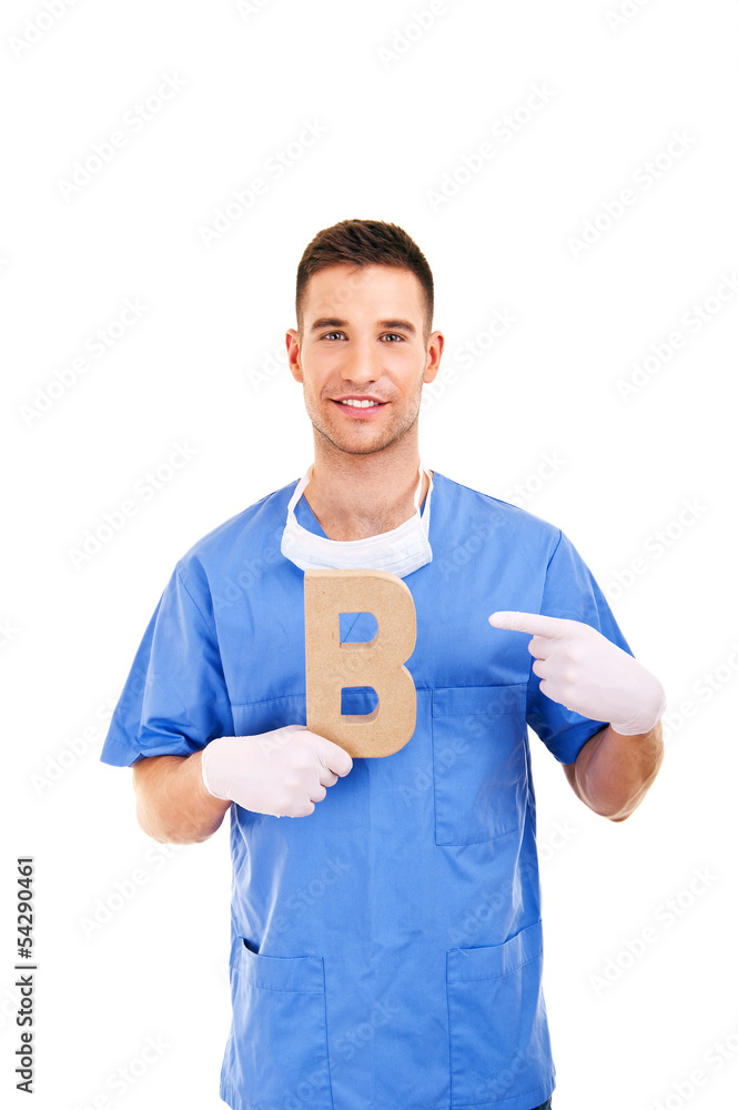 young doctor holding letter b young doctor holding letter b