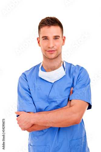 Young doctor man with crossed hands