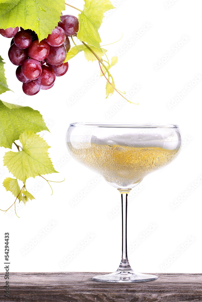 grapes with glass of champagne on a table grapes with glass of champagne on a table