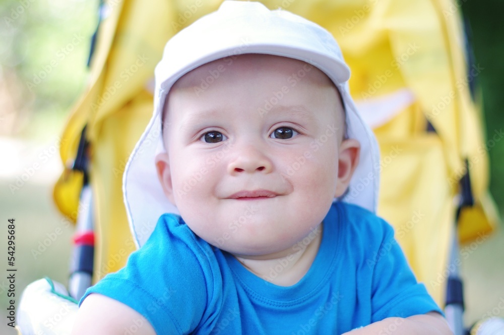 funny baby age of 9 months on yellow baby carriage funny baby age of 9 months on yellow baby carriage