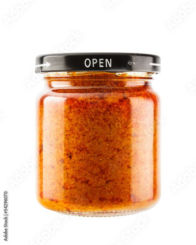 Massaman curry paste in glass jar isolated on white background