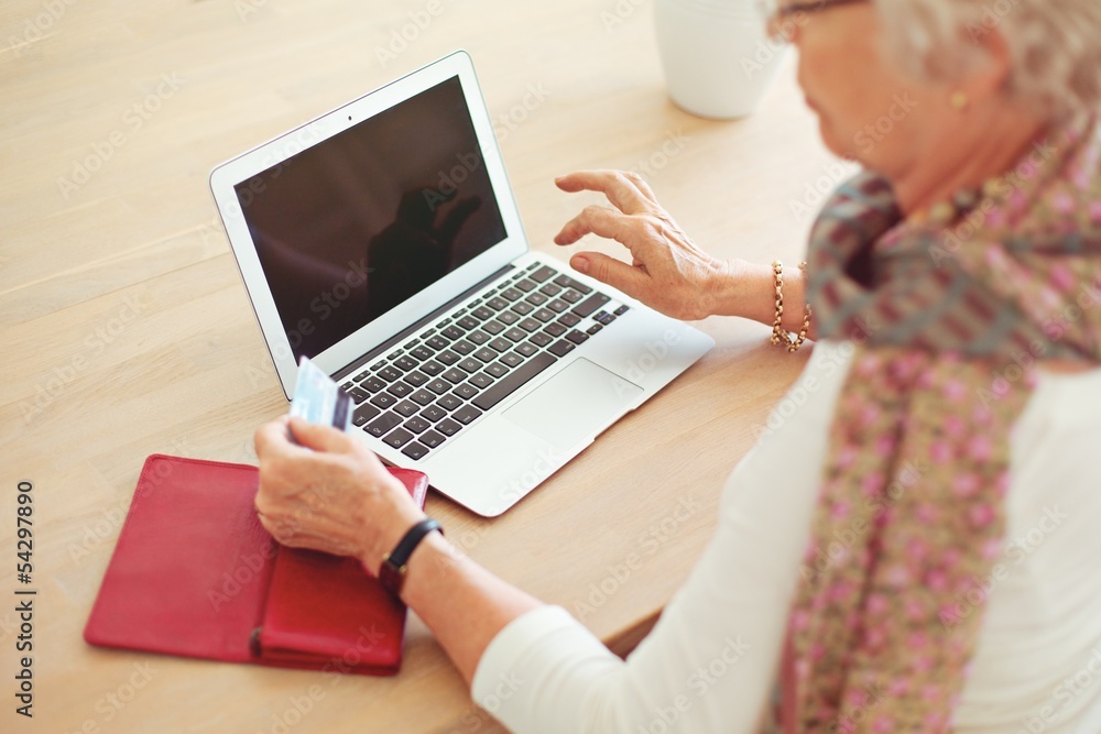 Old Woman Using Laptop with Blank Screen
