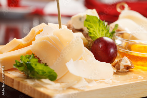 Cheese plate with grapes and honey