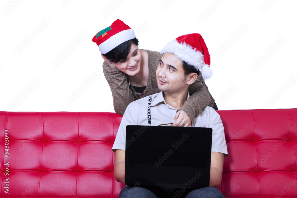 Couple buying christmas gift online - isolated Couple buying christmas gift online - isolated