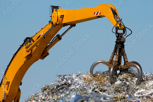 Close-up of a crane for recycling metallic waste photo