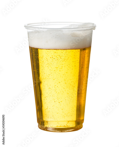 Golden lager or beer in disposable plastic cup