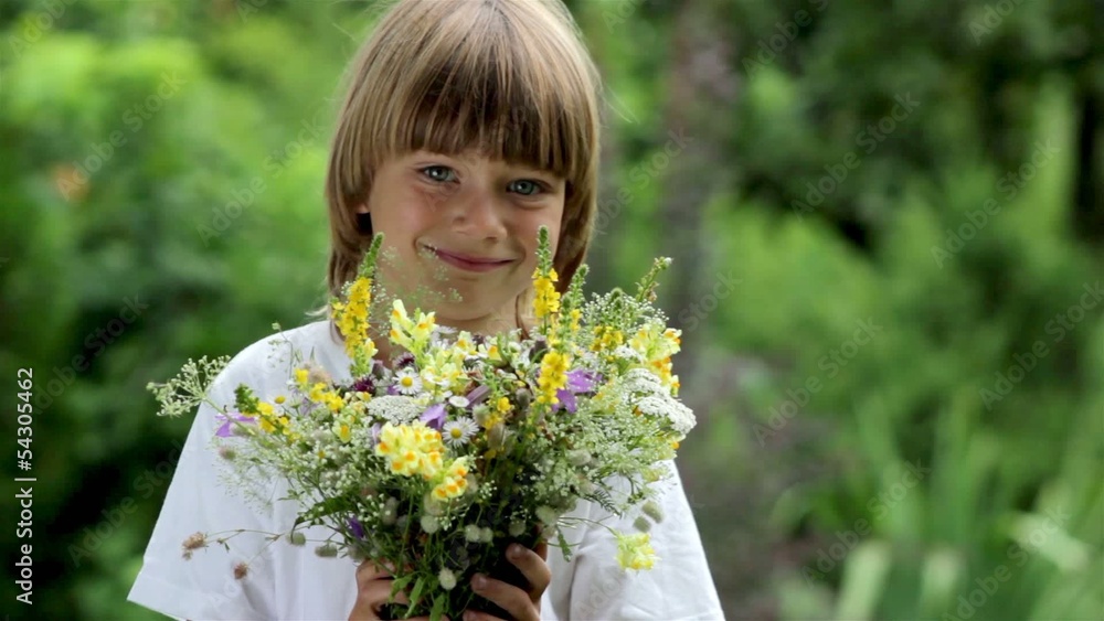 Portrait of a boy with a bouquet of wild flowers Portrait of a boy with a bouquet of wild flowers