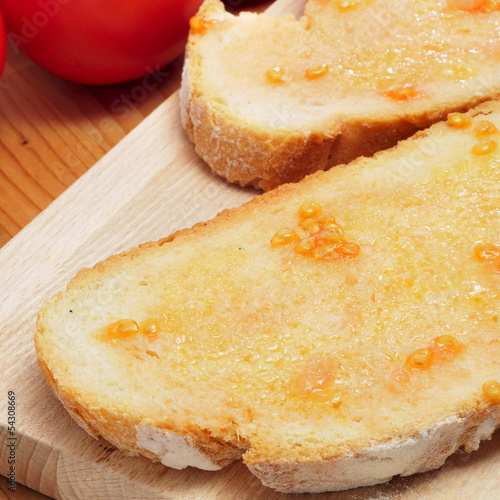 pa amb tomaquet, bread with tomato, typical of Catalonia, Spain photo