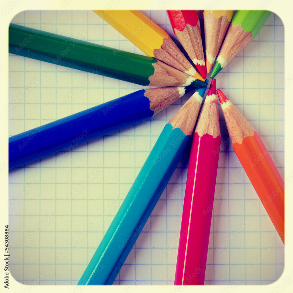 Naklejka premium pencil crayons on a notebook