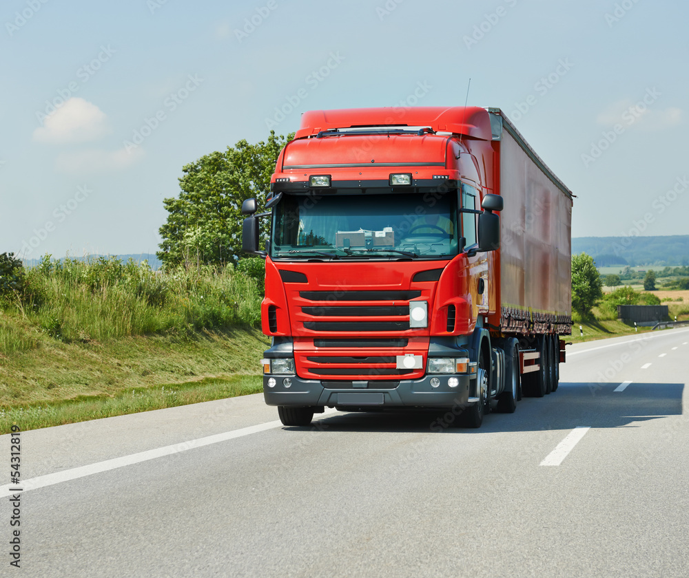 red lorry with trailer on highway red lorry with trailer on highway