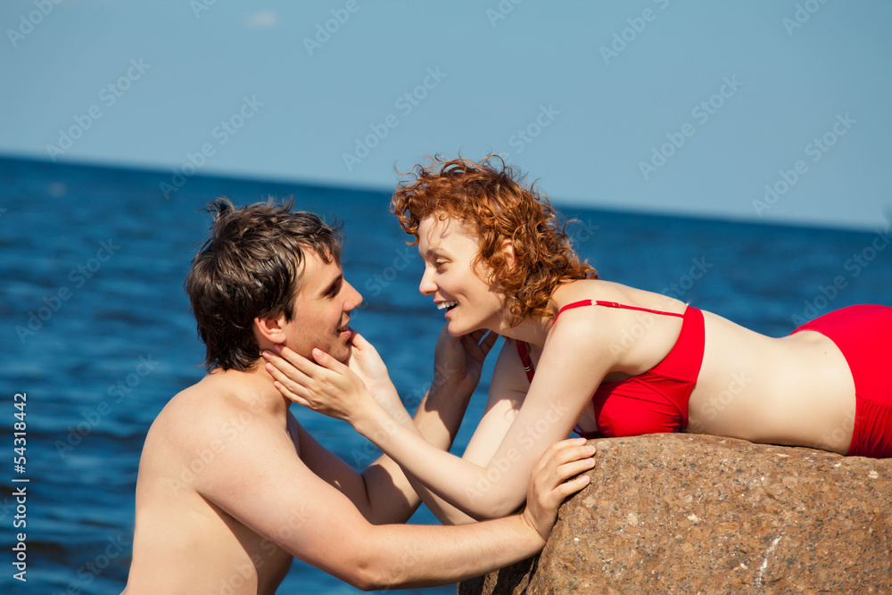 couple of lovers or family relaxing on the rock couple of lovers or family relaxing on the rock