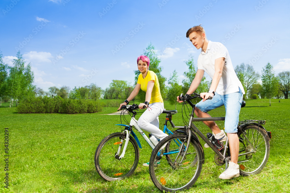 Two people on bikes