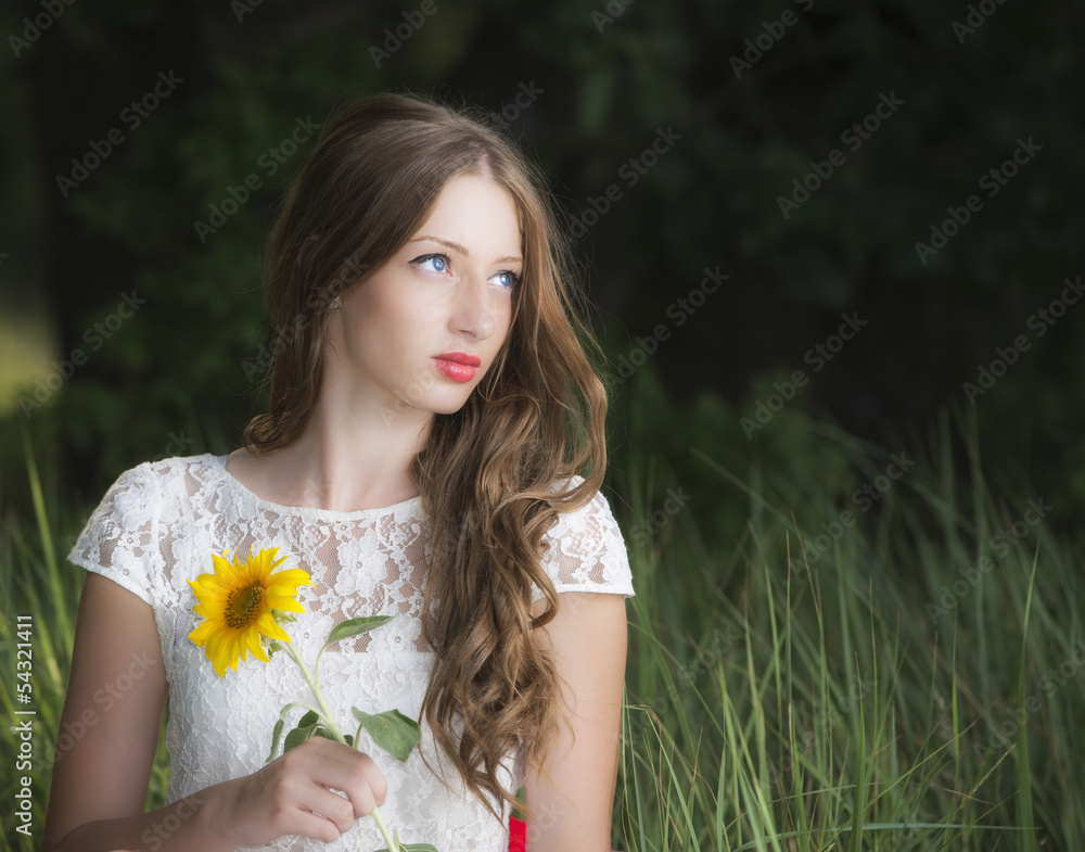 Portrait of young attractive woman at summer green park. Portrait of young attractive woman at summer green park.