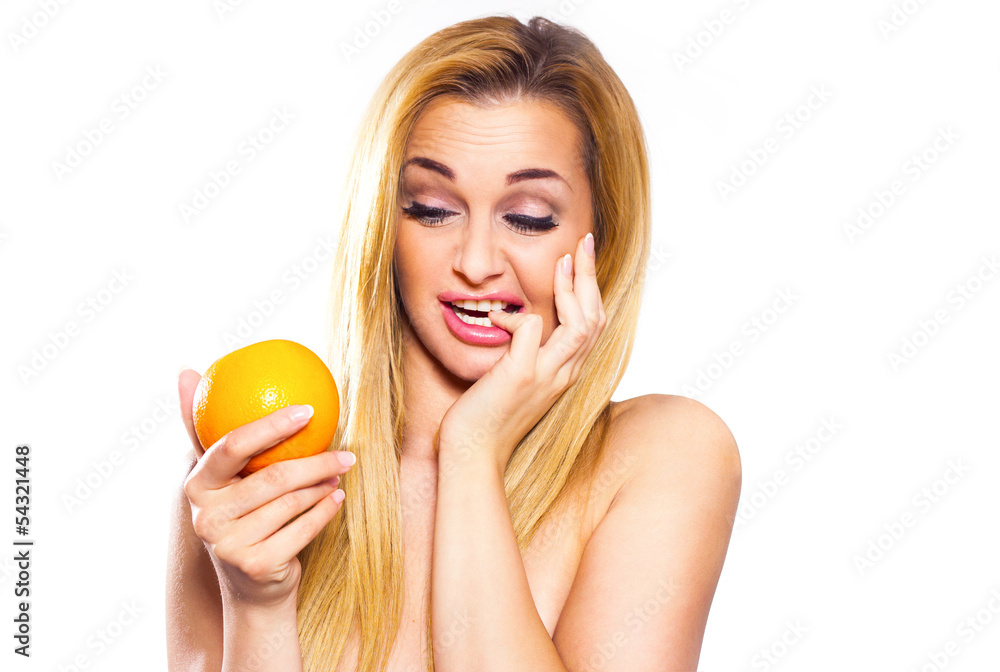 A young girl has been reluctant to eating oranges.