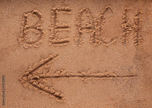 slogan on a sand. go to beach.