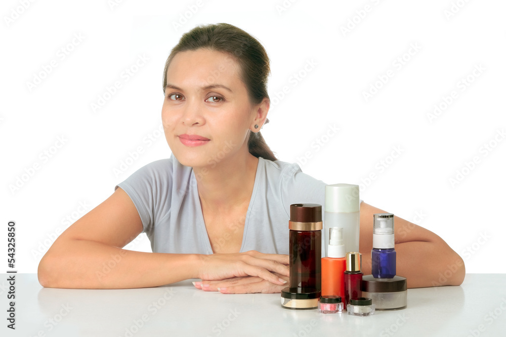 Isolated middle age asian woman with cosmetic cream Isolated middle age asian woman with cosmetic cream