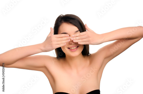 Portrait of a beautiful woman hiding her beauty behind hands