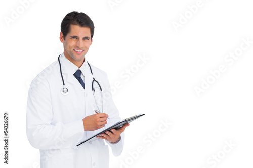 Handsome doctor holding a clipboard and pen