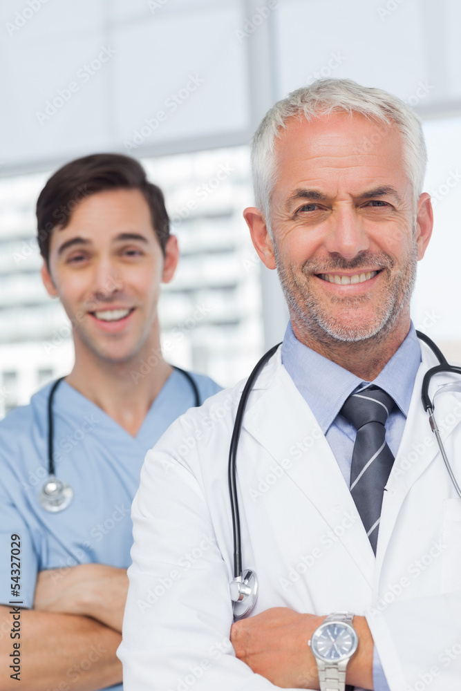Smiling doctors with arms crossed Smiling doctors with arms crossed