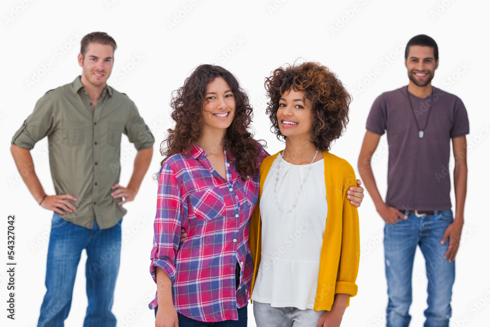 Fashionable young friends smiling at camera Fashionable young friends smiling at camera