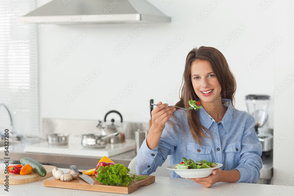 Woman eating a vegetarian salad