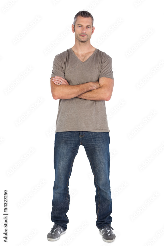 Focused man with arms crossed Focused man with arms crossed