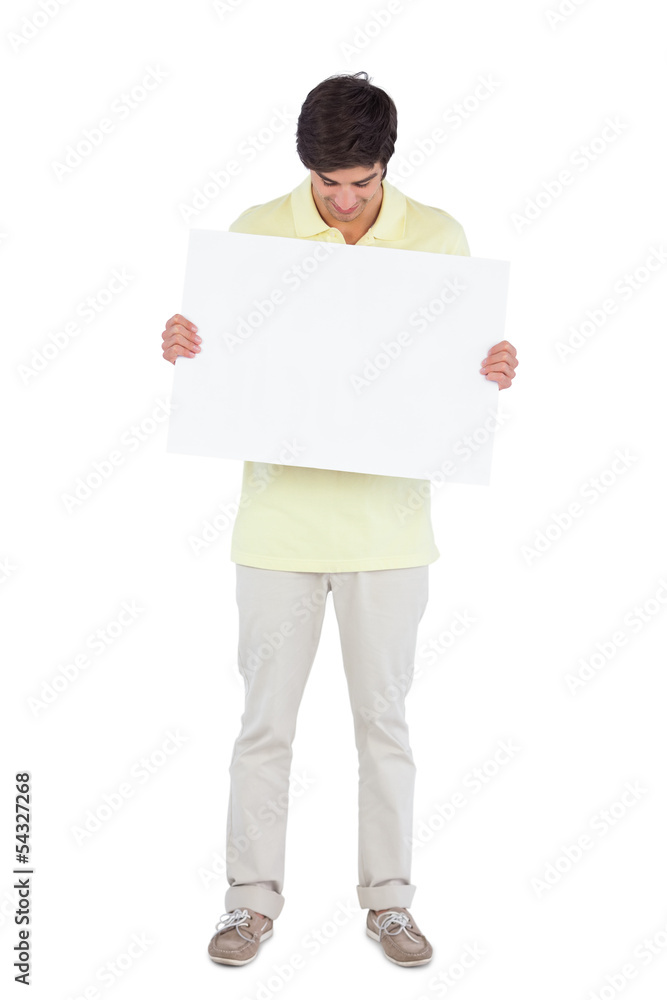 Young man looking at empty panel Young man looking at empty panel