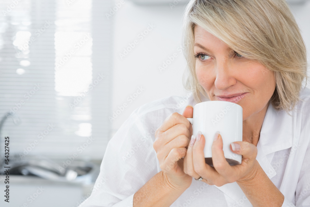 Content woman having coffee in the morning Content woman having coffee in the morning