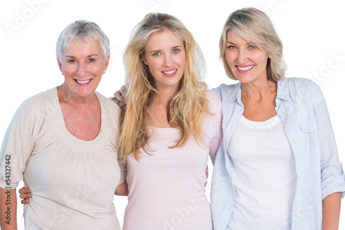 Three generations of happy women smiling at camera