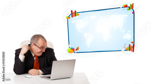 businessman sitting at desk and looking the laptop with copy spa photo