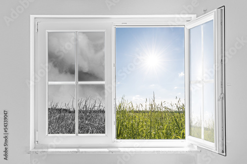 window with storm and sun