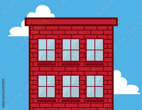 Tall red brick building in the sky with windows
