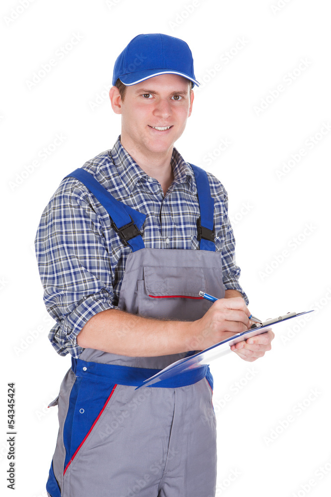 Fototapeta premium Male construction worker holding clipboard