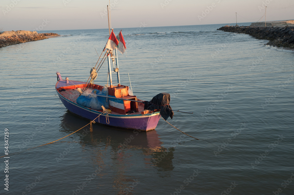 Fototapeta premium fisherman boat at sunrise time