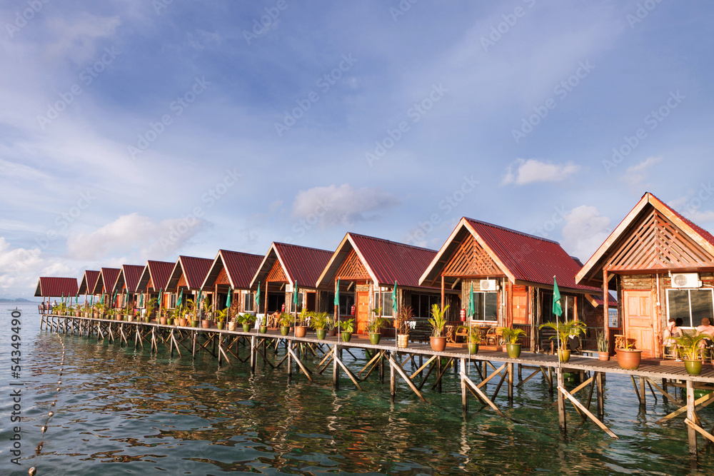 Obraz premium Over water bungalow with bule sky