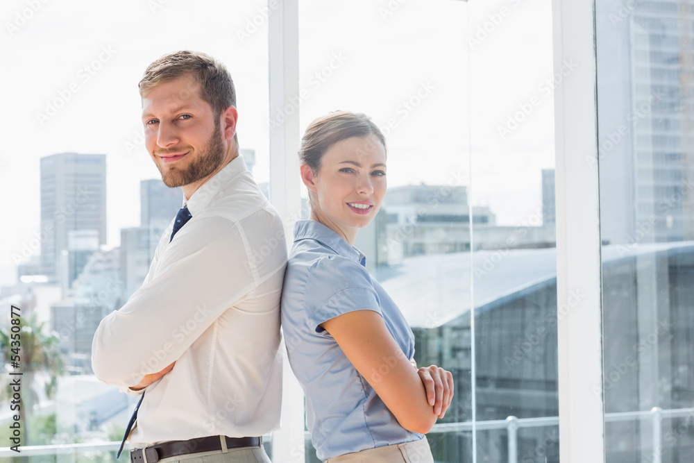 Fototapeta premium Happy business team standing back to back