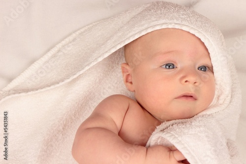 baby in white towel