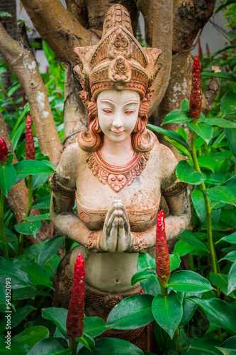 Ancient woman sculpture in the garden