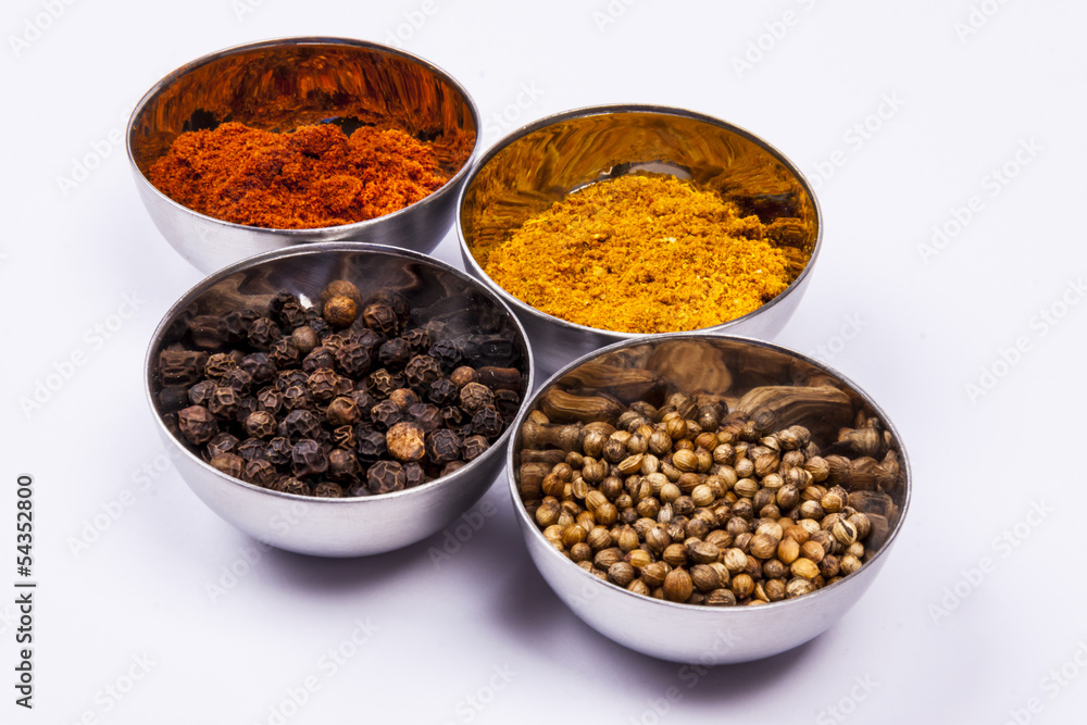 Curry, pepper,  paprika and coriander - white background.