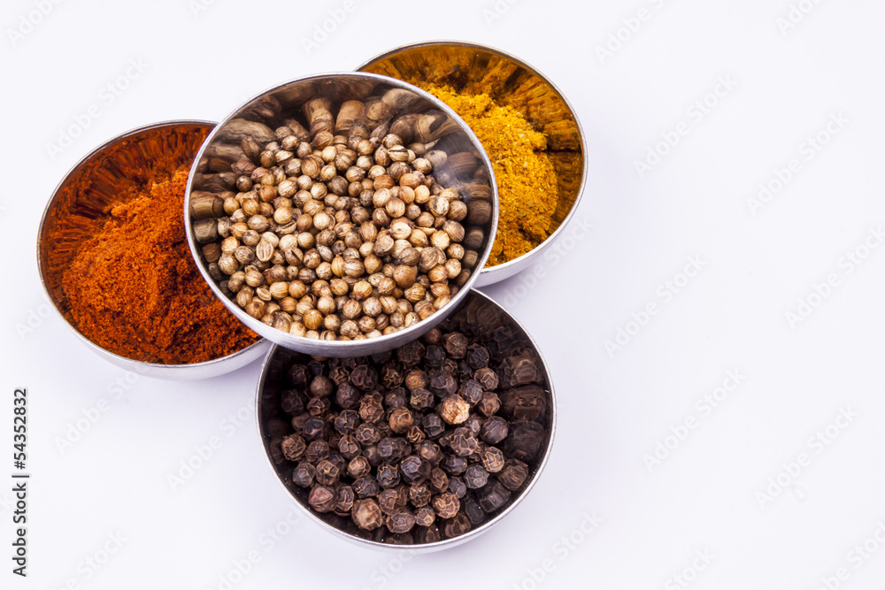Curry, pepper, paprika and coriander - white background. Curry, pepper, paprika and coriander - white background.