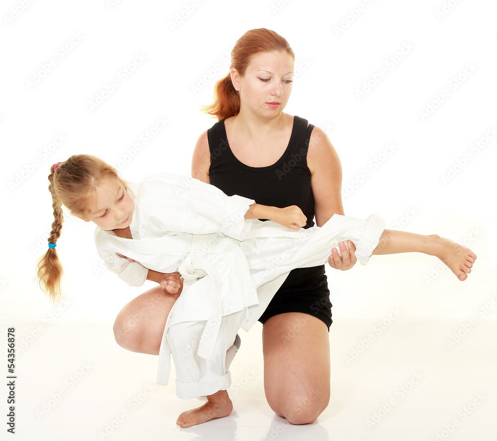 Mom teaches daughter punch kicking karate Mom teaches daughter punch kicking karate