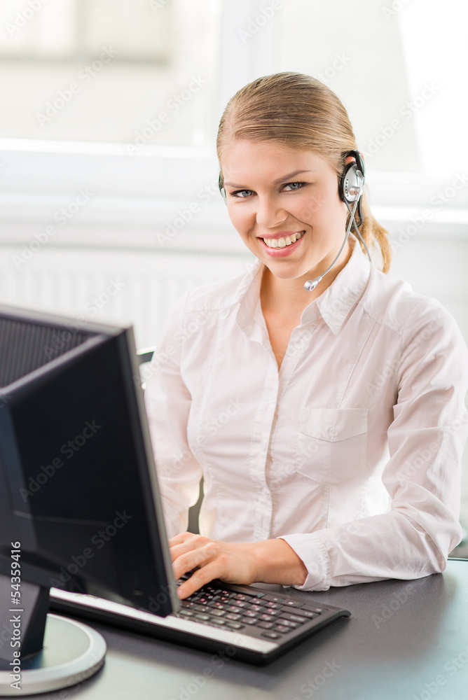 Young professional female phone assistant of call center Young professional female phone assistant of call center
