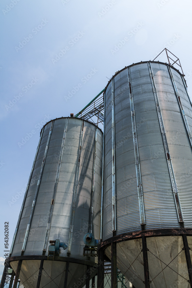 Two metal silo