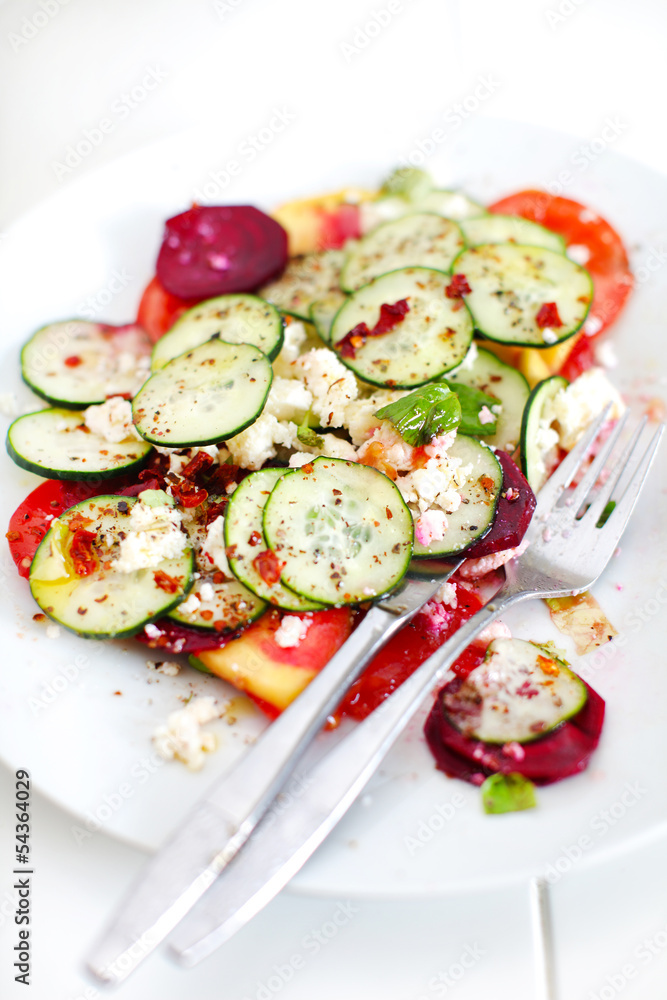 Cucumber salad with tomatoes, cottage cheese and chili basil