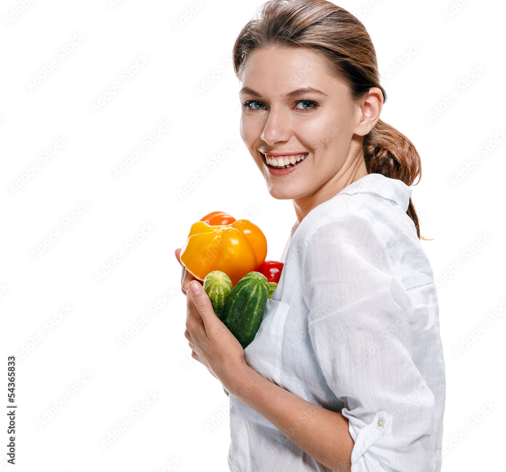 promo girl holds yellow paprika and green cucumbers promo girl holds yellow paprika and green cucumbers